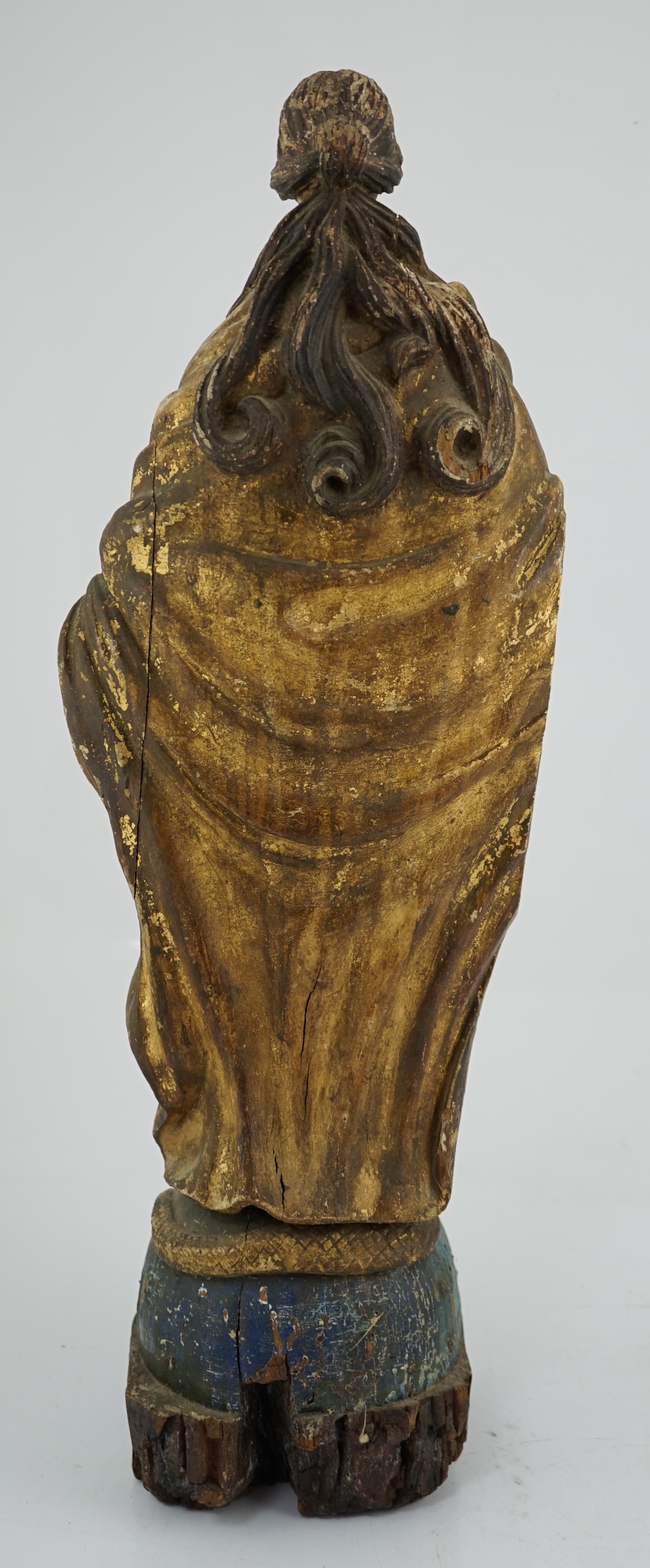 An 18th century Continental carved wood figure of a female saint